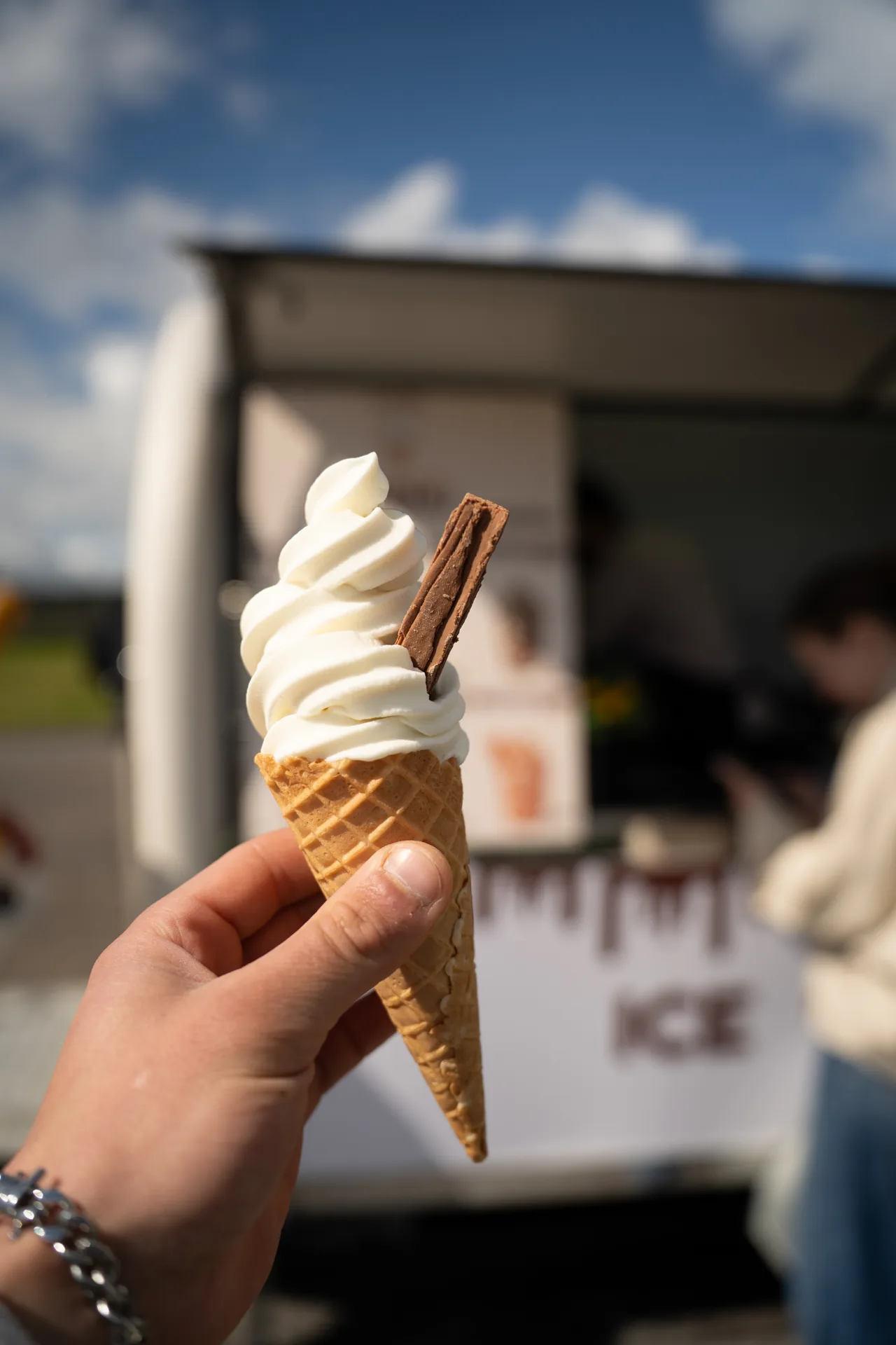 Enjoying a Swirl sundae cone by the coast