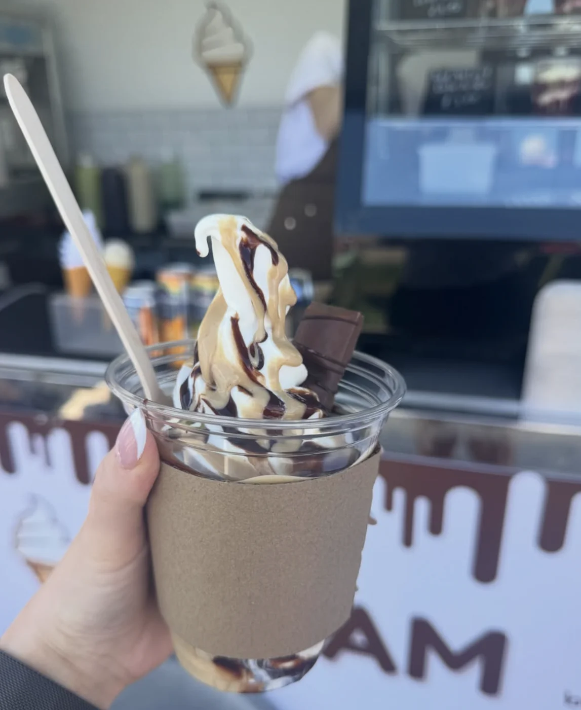 Soft serve cup with chocolate and caramel swirl at the trailer