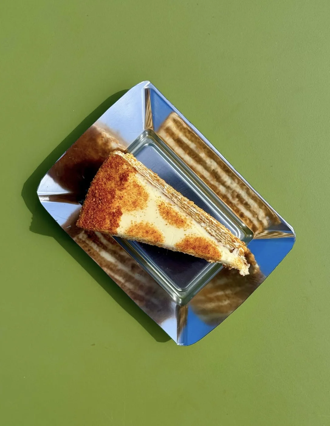 Slice of honey cake dusted with cinnamon